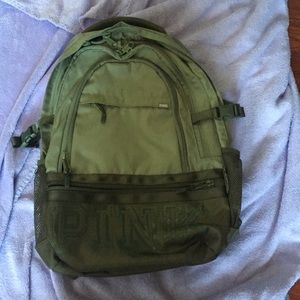 An army green PINK backpack